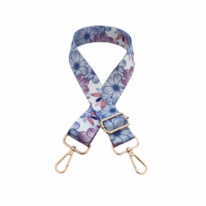Adjustable crossbody bag strap with blue floral print and gold hardware hooks