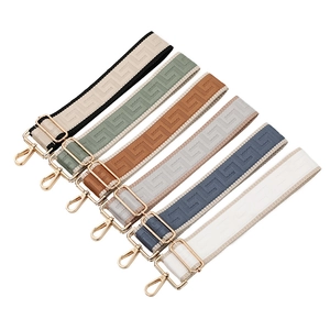 Adjustable wide woven bag straps with geometric patterns and gold metal buckles