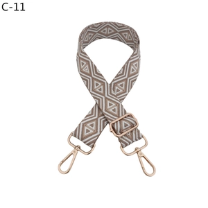 Close-up of diamond pattern strap with rose gold hooks and adjustable metal buckle