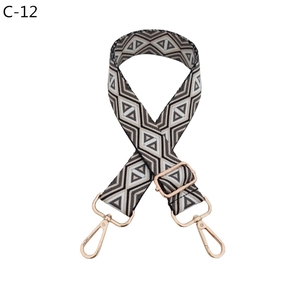 Detail of adjustable rhombus pattern strap with rose gold lobster clasps for bags