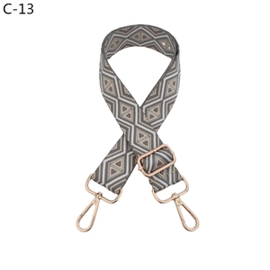 Detail of grey and white geometric woven canvas strap with rose gold lobster clasps