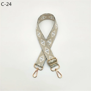 Close-up of adjustable beige and grey geometric diamond pattern jacquard bag strap