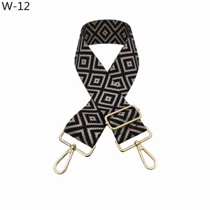 Detail of adjustable geometric strap with premium gold metal swivel snap hooks