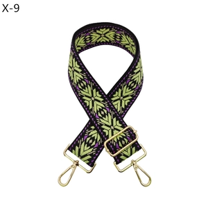 Detail of adjustable geometric ethnic style bag strap with gold lobster clasps