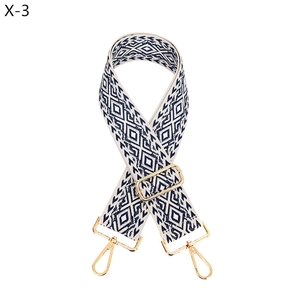 Close-up of bohemian navy and cream woven strap with high-gloss gold alloy buckles