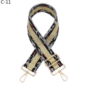 Detail of leopard jacquard strap with gold glitter stripe and shiny lobster clasps