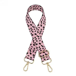 Detailed view of leopard print pink bag strap with adjustable gold alloy buckles