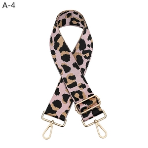 Detail of pink leopard print wide bag strap with premium gold swivel hooks and buckle