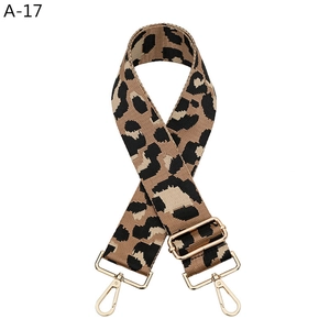 Detailed view of adjustable leopard print bag strap with high-quality gold metal clasps