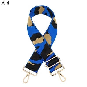 Detail of adjustable camo bag strap with blue leopard print and gold metal swivel hooks