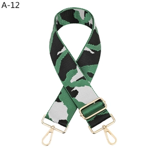 Detail of green tiger pattern woven strap with premium golden metal buckles and clips