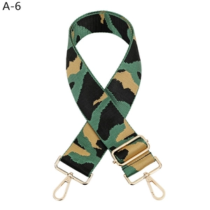 Detail of adjustable camouflage bag strap with premium golden metal swivel hooks