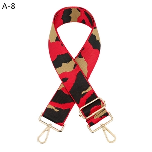 Close-up of camouflage woven replacement strap with premium gold metal hooks