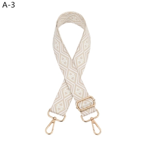 Detail of adjustable woven strap with beige diamond pattern and gold metal lobster clasps