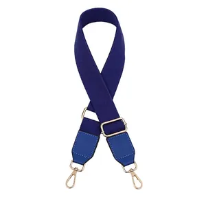 Deep blue adjustable woven strap with PU leather ends and gold metal hooks