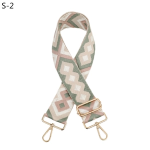Adjustable woven guitar style bag strap with pink and green geometric diamond patterns