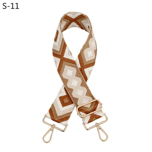 Detail of adjustable bohemian rhombus jacquard strap with gold metal lobster clasps