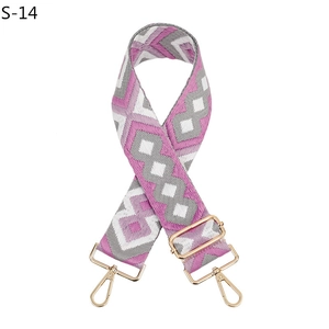 Detail of adjustable purple geometric diamond woven strap with gold metal hooks