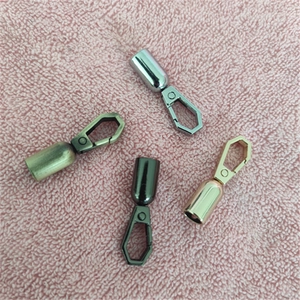 Close-up of four colors zinc alloy spring snap hooks in gold, silver, bronze and black