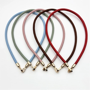 Detail of colorful PU leather straps with golden lobster clasps for DIY handbag accessories