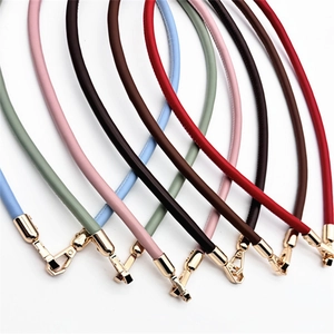 Macro shot of colorful PU leather bag straps with golden swivel hooks in multiple colors