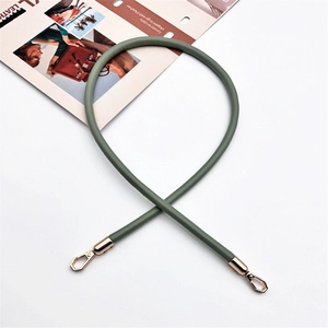 Detail of sage green PU leather strap with premium gold lobster clasps for handbags