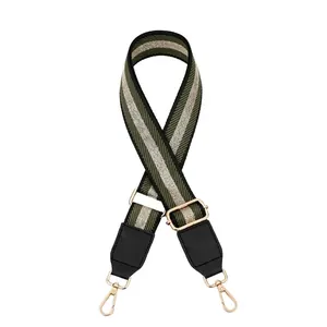 Adjustable wide striped canvas shoulder strap with green silver webbing and gold hardware