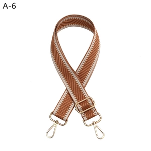 Adjustable wide replacement bag strap featuring brown and beige herringbone woven pattern