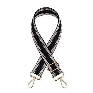 Adjustable black and grey geometric wave pattern bag strap with gold metal hardware