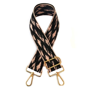 Adjustable wide ethnic style handbag strap with black and pink pattern and gold hooks