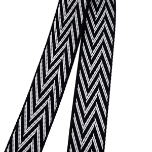 Macro detail of high-density black and white chevron woven adjustable bag strap