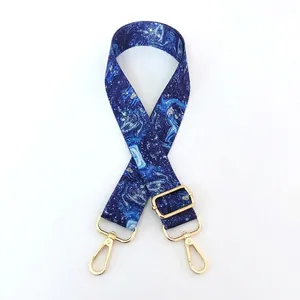 Detail of adjustable star marble pattern bag strap with premium gold metal swivel hooks