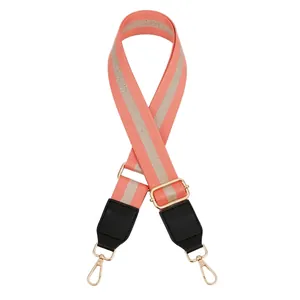 Detail of adjustable coral pink and gold striped strap with black leather and gold buckle
