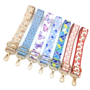 Adjustable heat transfer shoulder straps for bags with colorful floral patterns and gold hooks