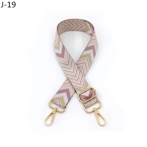 Adjustable crossbody bag strap with pink and gold chevron weave and swivel metal hooks