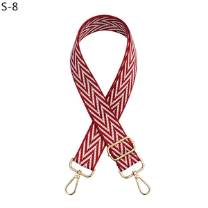 Adjustable red and white chevron woven strap with polished gold-tone metal clasps