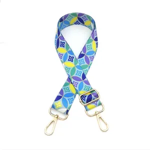 Adjustable crossbody bag strap with colorful geometric floral print and gold hardware