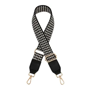Adjustable black and white houndstooth canvas purse strap with gold metal hardware and PU leather