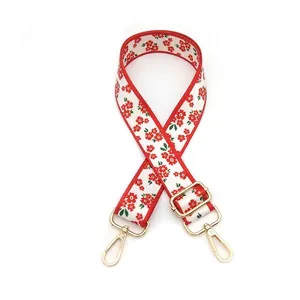 Detail view of the floral patterned adjustable strap with golden lobster clasps
