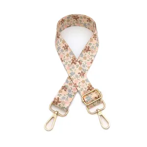 Adjustable floral pattern bag strap with golden metal swivel hooks and buckles