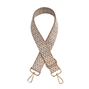 Adjustable chevron bag strap with brown and white weaving and gold metal hooks