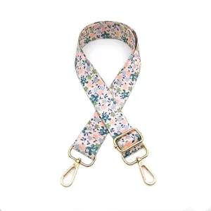 Detail view of floral replacement strap with gold lobster clasps and adjustable buckle