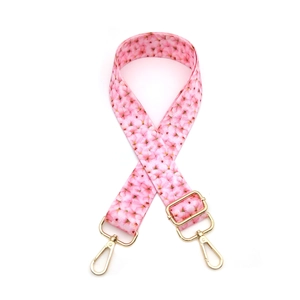 Pink floral bag strap with gold lobster clasps and adjustable length for crossbody bags