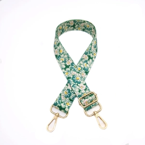 Adjustable wide floral shoulder strap with green daisy print and gold lobster clasps