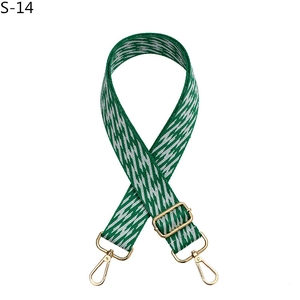 Adjustable green and white wave patterned bag strap with gold metal lobster clasps