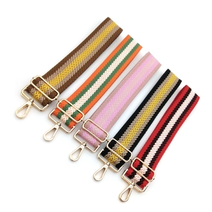 Wide adjustable woven bag straps with geometric patterns and golden lobster clasps