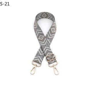 Close-up of adjustable woven guitar strap for handbags with geometric diamond patterns