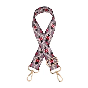 Adjustable woven strap with grey red geometric pattern and golden metal lobster clasps