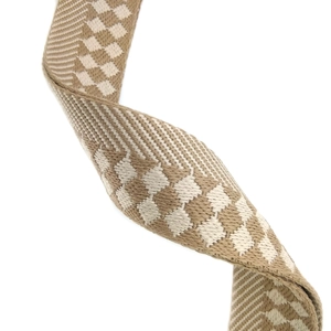 Macro detail of thick woven checkered shoulder strap with durable beige twill texture