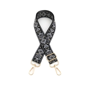 Ethnic style black and white woven guitar bag strap with gold metal lobster clasps
